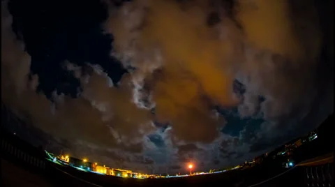 Time lapse OF clouds over the sea at night Stock Footage 27318883