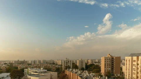 Time-lapse of clouds over a simple city neighborhood Stock Footage 95734607