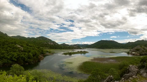 Time lapse of clouds over Skadar lake and mountains Stock Footage 169896359