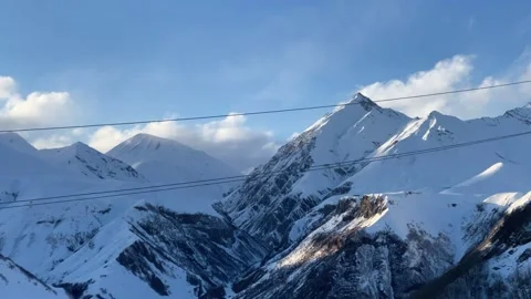 Time lapse clouds over snow-capped mountains Stock Footage 152486672