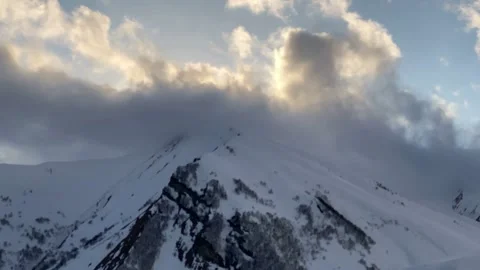 Time lapse clouds over snow-capped mountains Stock Footage 152486786