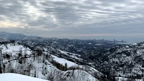 Time-lapse clouds over snow-capped mountains Video stock 164089174