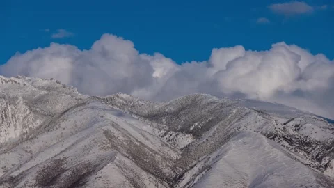 Time Lapse - Clouds over Snow-capped Mountains in Utah Stock Footage 248917373