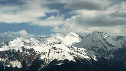 Time lapse of clouds over snowy mountains Stock Footage 124666335
