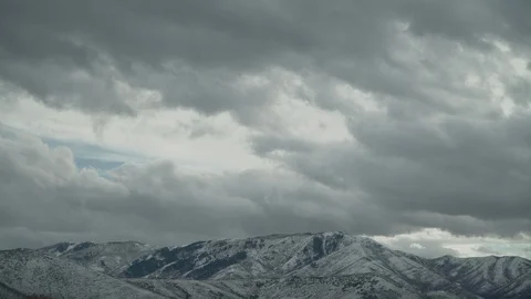Time lapse of clouds over snowy mountains Stock Footage 125799897