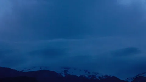 Time-lapse of clouds over snowy Mainarde mountains after sunset, Italy Stock Footage 346821516