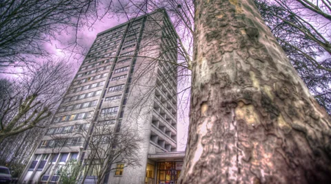 TIME LAPSE - CLOUDS OVER TREES AND BUILDING Stock Footage 29989214