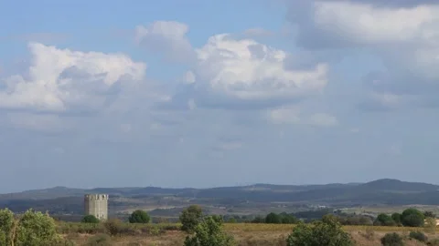 Time lapse of clouds over vineyards and castle, France Stock Footage 164597421