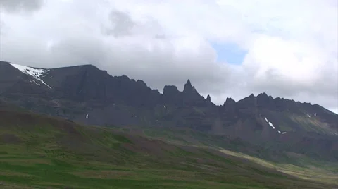 Time lapse clouds over volcanic land forms at glacial valley Stock Footage 37319705