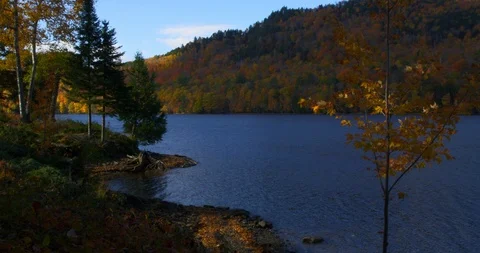 Time Lapse clouds over Wyman Lake &amp;  Fall Foliage on the Kenebec River, Maine Stock Footage 85650946