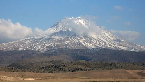 Time lapse clouds pass over snow capped Hasan Dagi volcano in Central Anatolia Stock Footage 339367477