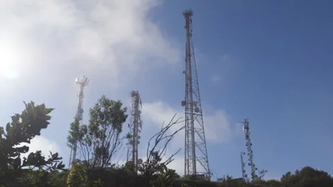 Time lapse of clouds passing high antennas Stock Footage 138391987
