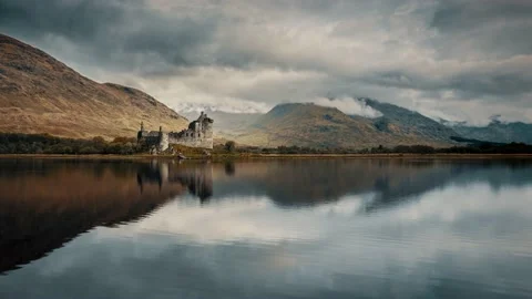 Time lapse of clouds passing Kilchurn Castle on Loch Awe in Scotland Stock Footage 143137463