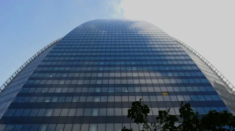Time Lapse of Clouds Passing Modern Office Building Stock Footage 64122246