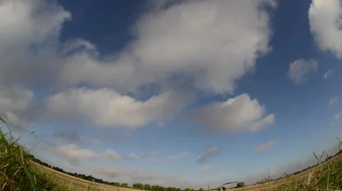 Time lapse clouds passing over countryside on summers day Stock Footage 23360071