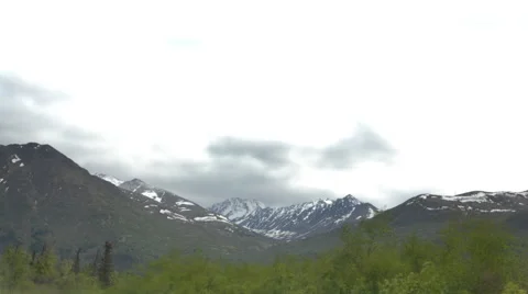 Time-lapse of clouds passing over mountains near Anchorage, Alaska. Stock Footage 52216440
