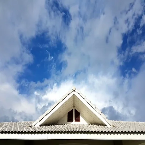 Time lapse clouds passing over house gables, Thailand Stock Footage 69433993