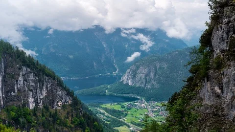 Time Lapse of clouds passing over mountain lake in Austrian Alps. Stock Footage 91183598