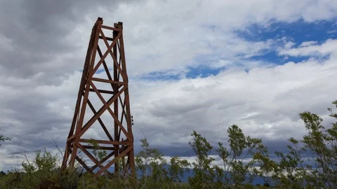 Time Lapse of Clouds Passing Over an Old Water Tower Stock Footage 108872179