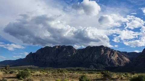 Time Lapse of Clouds Passing Over a Desert Mountain Stock Footage 109068950
