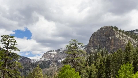 Time Lapse of Clouds Passing Over Mountains Stock Footage 109425751