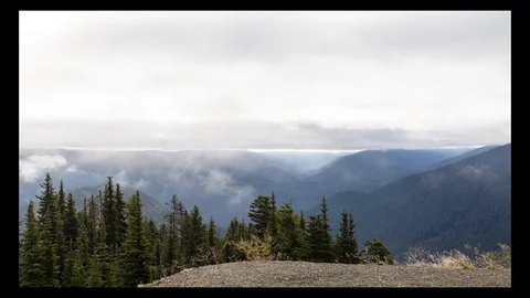 Time lapse of clouds passing over mountains from lookout point Stock Footage 116823094