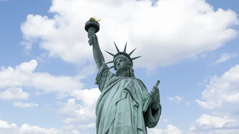 Time lapse of clouds passing over the Statue of Liberty. Stock Footage 128535744