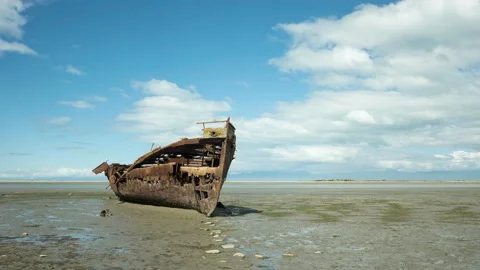 Time-lapse of clouds passing over a wreck at low tide, New Zealand. Stock Footage 145622511