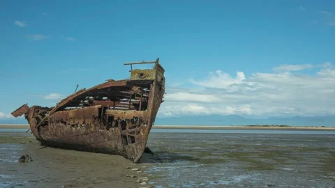 Time-lapse of clouds passing over wreck at low tide. Motueka, New Zealand. Stock Footage 148058906