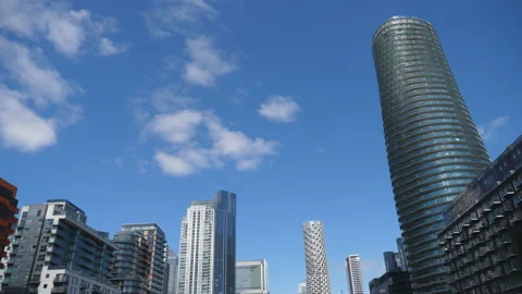 Time lapse. Clouds passing over a city with modern high raise buildings. Stock Footage 198691002