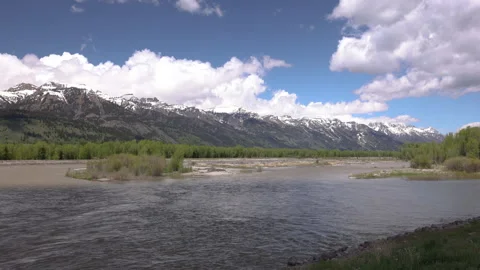Time Lapse of Clouds Passing Over Teton Mountains and Snake River 스톡 동영상 267438746
