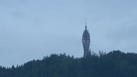 Time lapse of clouds passing Worhersee Tower Stock Footage 71532836