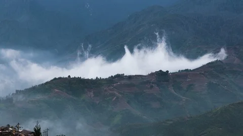 Time-lapse of clouds racing over a mountain top in Sapa Valley Vietnam. Stock Footage 93692362