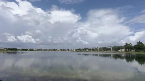Time Lapse Clouds with Rain Bands Over Lake Stock Footage 200890566