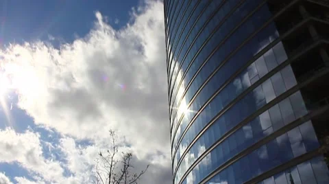 Time lapse Clouds reflected on Building Stock Footage 45252177