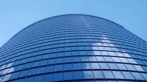 Time-Lapse Clouds Reflected in Glass Walls Stock Footage 137889448