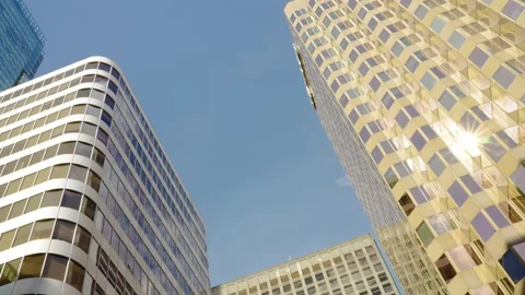 Time lapse of clouds reflecting into the glass of a large office building Stock Footage 246560217