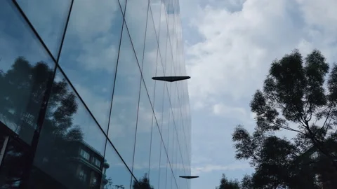 Time lapse. Clouds reflection on a glass building. Stock Footage 90613663