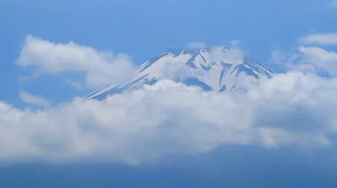 Time-lapse clouds rolling across Mount Fuji's peak. Stock Footage