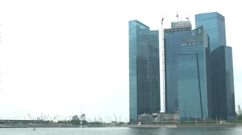 Time Lapse of clouds rolling by at office buildings in financial district Video stock 35409669