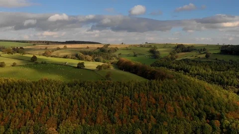 Time-lapse of clouds rolling over the green fields Stock-Footage 102188375