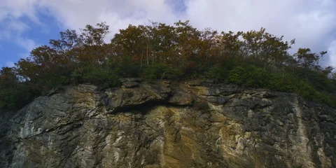 Time-lapse of clouds rolling over the cliff Stock Footage 103785807