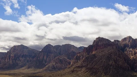 Time Lapse of Clouds Rolling Over a Mountain Range Stock Footage 107946778