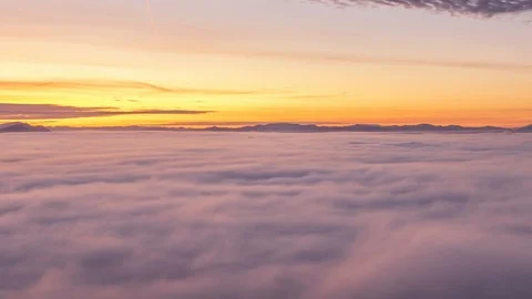 Time lapse clouds rolling over basin flat land in sunrise Stock-Footage 120990979