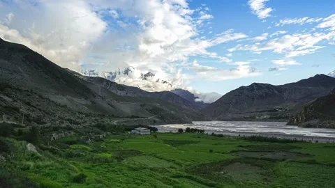 Time-lapse of Clouds Rolling Over Rice Fields and Himalayan Mountains Vídeo Stock 134582368