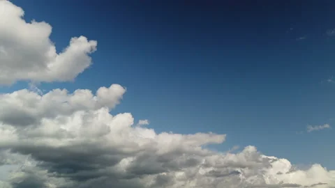 Time lapse clouds, rolling puffy cloud are moving, white lightnes clouds time Stock Footage 157338270