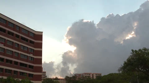 Time Lapse of clouds rolling by at Singapore apartments Video stock 35409377