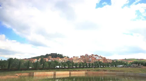 Time lapse of clouds running over old style europe village, 4k clip. Stock Footage 45955948