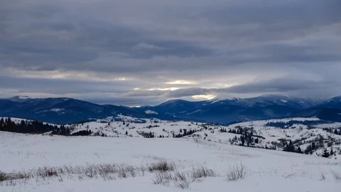 Time lapse of clouds running over white snowy mountain landscape. Winter moun Stock Footage 100742730