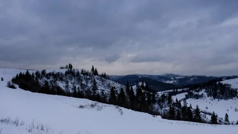 Time lapse of clouds running over white snowy mountain landscape. Winter moun Stock Footage 100742733